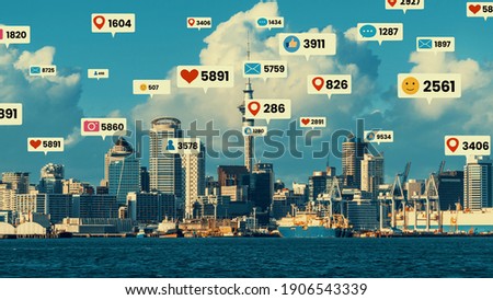 Social media icons fly over city downtown showing people engagement connection through social network application platform . Concept for online community and social media marketing strategy .