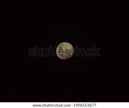 The first full moon of January 2021 also referred as the wolf moon Bright moon on a dark sky