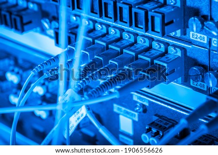 server with fiber optic cables in data center Royalty-Free Stock Photo #1906556626