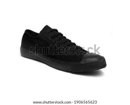black canvas sneaker isolated on white background