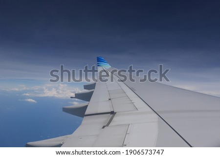 View from airplane wing and blue sky.