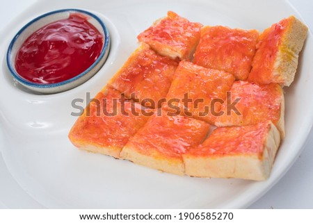 Strawberry Jam on bread serve on white plate 