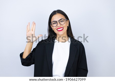 Beautiful business woman doing hand symbol