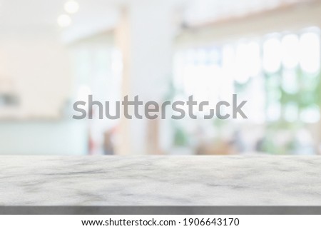 marble table top with blurred abstract hotel interior background