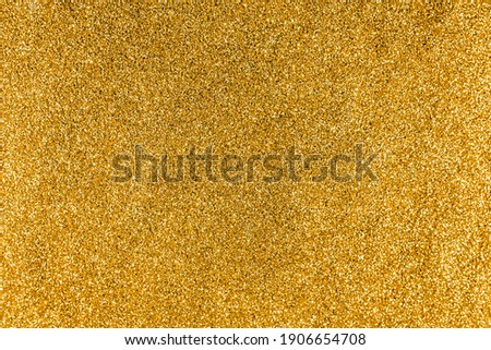 Gold background with glitter, lights. Christmas background, texture