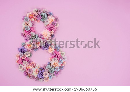 International Women's Day. Banner, flyer, beautiful postcard for March 8. Flowers in the shape of the number 8 on a pink background. Royalty-Free Stock Photo #1906660756