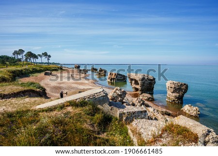 Liepaja, Latvia: View of the Karosta coast littered with parts of the fortifications of the naval base of Tsarist Russia.  Royalty-Free Stock Photo #1906661485