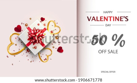 template for coupon or advertisement for valentine's day.pink background with 50 % discount.A box with a gift and a red shiny ribbon,with gold hearts,red paper hearts and scattered sparkles. flat lay