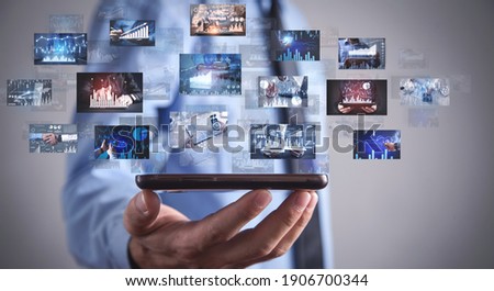 Man holding a digital pictures of business graphs. Business. Technology