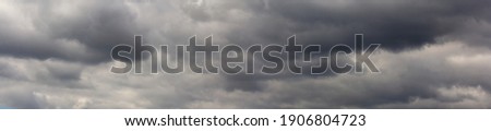 Dark storm clouds before rain. Clouds become dark gray before raining. Abstract dramatic background.
