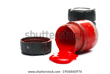 Bottle, container with spilled red paint, printer color isolated on white background