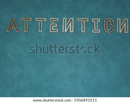 The word Attention is made of wooden letters on colorful backgrounds. High quality photo