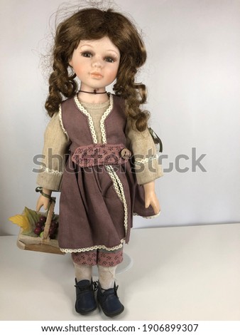 Porcelain doll with curly hair