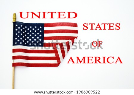 American flag with red text