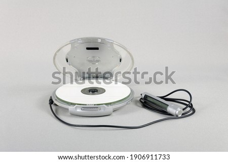 Media player with control and disk on gray isolate background