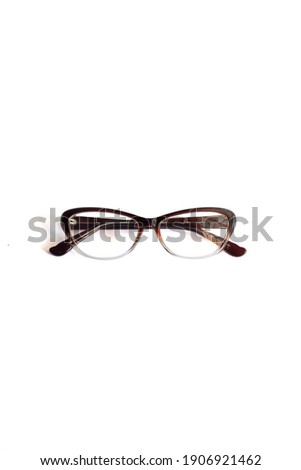 Transparent brown cat eye women's glasses. photographed from the front against a white background
