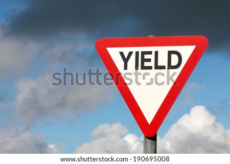 Give way sign with text yield