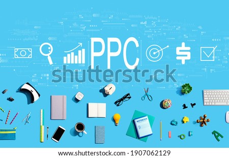 PPC - Pay per click concept with collection of electronic gadgets and office supplies