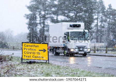 Heavy Lorry pass Test Centre sign in winter condition 