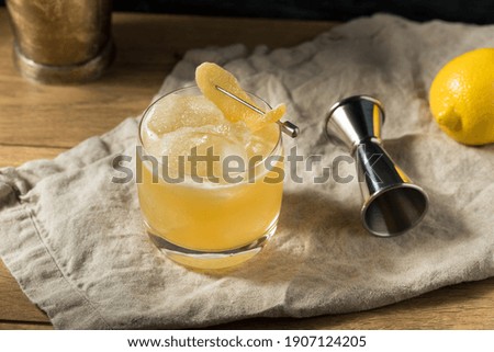 Boozy Alcoholic Penicillin Cocktail with Scotch and Ginger Royalty-Free Stock Photo #1907124205