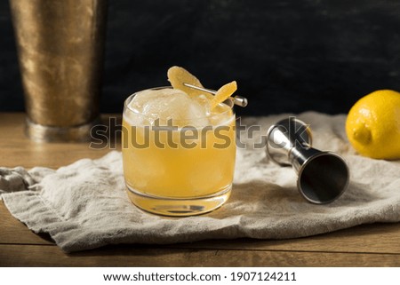 Boozy Alcoholic Penicillin Cocktail with Scotch and Ginger Royalty-Free Stock Photo #1907124211