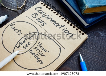 Confirmation bias with facts and prior beliefs written on the page. Royalty-Free Stock Photo #1907125078