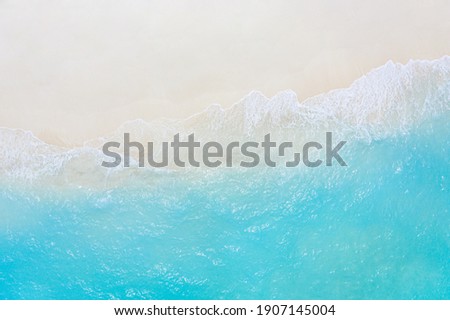 Relaxing aerial beach scene, summer vacation holiday template banner. Waves surf with amazing blue ocean lagoon, sea shore, coastline. Perfect aerial drone top view. Peaceful bright beach, seaside Royalty-Free Stock Photo #1907145004