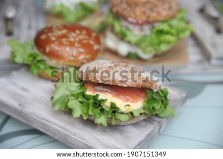 hamburger with salmon on rye ciabatta