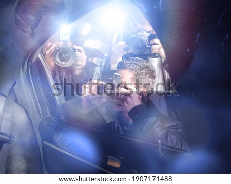 Paparazzi taking pictures through car window