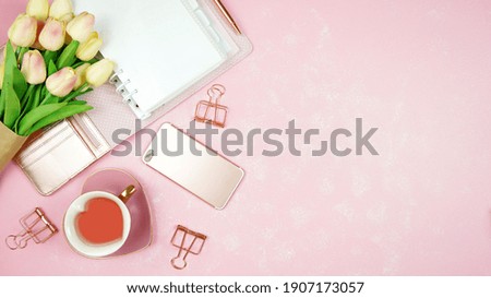 Springtime pink theme desktop workspace with mockups on stylish textured background. Top view blog hero header creative composition flat lay.