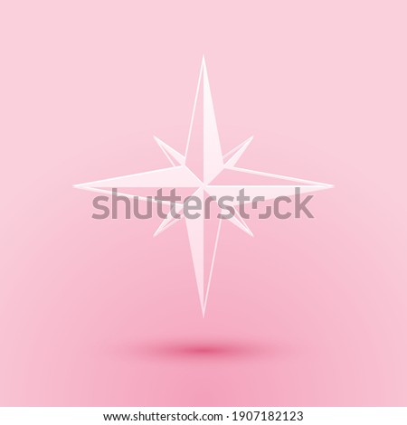 Paper cut Wind rose icon isolated on pink background. Compass icon for travel. Navigation design. Paper art style. Vector.
