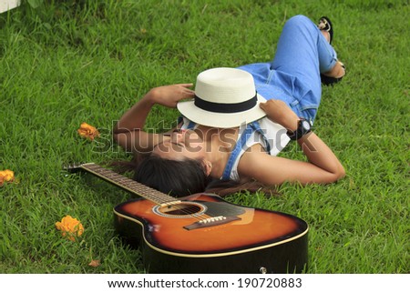 View of a beautiful young country girl with a guitar on the woods  Stock Photo
