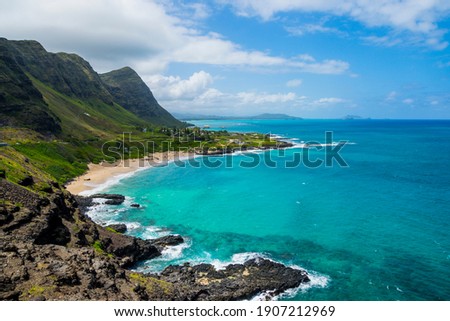 Rocky shoreline and pocket beach at Makapuʻu Point, western end of Oahu, Hawaii Royalty-Free Stock Photo #1907212969