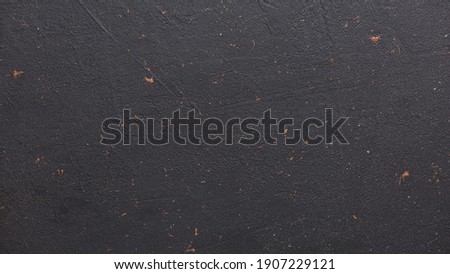 Texture of black stone background.