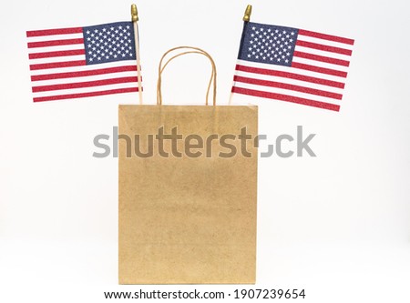 American flag in brown paper bag for holiday sales
