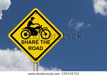 Share the Road Warning Sign, An road warning sign with words Share the Road and a motorcycle icon with blue sky background