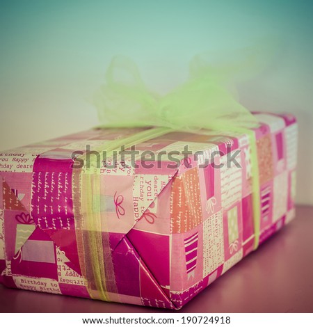 Giftbox with  Green ribbon. Instagram style processing