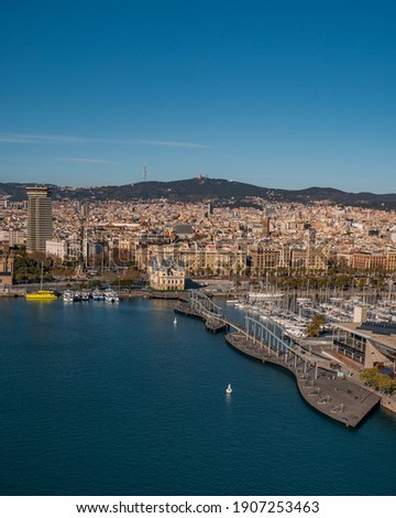 Aerial view over square Portal de la pau, and Port Vell marina and Columbus Monument in Barcelona, Catalonia, Spain