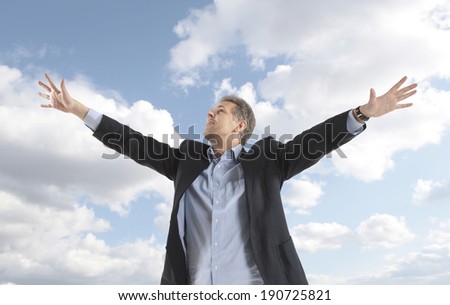 Free and relax of businessman under blue sky