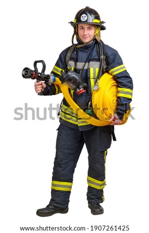 Full body young brave man in uniform and hardhat of firefighter holds firehose in hands and looking at camera isolated on white background