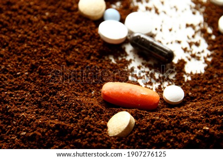 Throw expired medicine in coffee ground Royalty-Free Stock Photo #1907276125