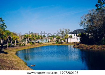 A typical Florida house and pond reflection	