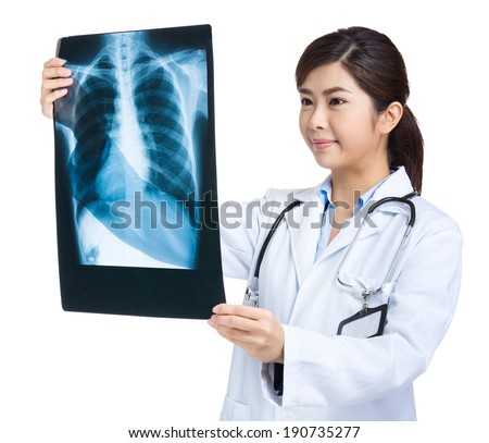 Woman doctor looking at x ray