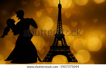 silhouette of  Eiffel Tower  at evening sunset light. isolated on heart bokeh background. Paris France. night scene. couple in love dancing tango. 