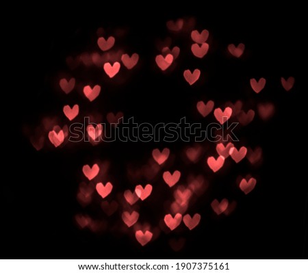 red hearts bokeh isolated on black background. 14th february. happy Valentines day. round frame. Royalty-Free Stock Photo #1907375161