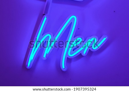 LED Neon lights Flex "Men" Text on White Background. Toilet Sign.