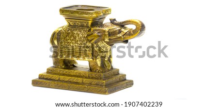 Swap meet. Indian elephant in the form of a candlestick. brass with carved ornament