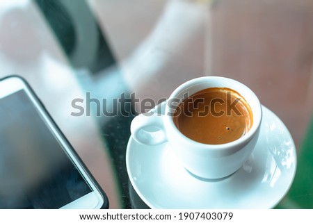 Cup of hot latte art cappuccino  Hot coffee cup on table, relax time. Cup of cappuccino coffee  Fresh brewed coffees with beautiful latte art on surface.