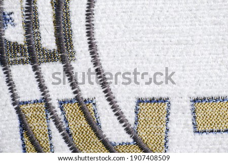 Zig-zag finishing stitch as an ornament on dense furniture fabrics for decor