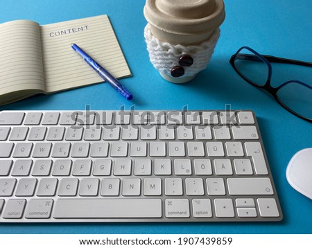 Content writing theme photo with white keyboard and note board